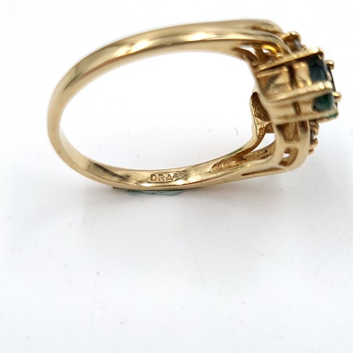 1075 - Star Lot : A stunning 9ct Gold ring with Emeralds and Diamonds. 
Size: M  Total weight: 2.9 g