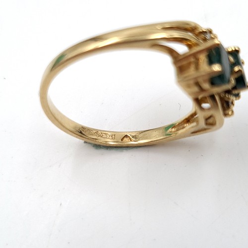 1075 - Star Lot : A stunning 9ct Gold ring with Emeralds and Diamonds. 
Size: M  Total weight: 2.9 g