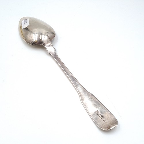 1085 - A very large Irish silver serving spoon. Hallmarked to Dublin and made by Reid & Son silversmiths. W... 