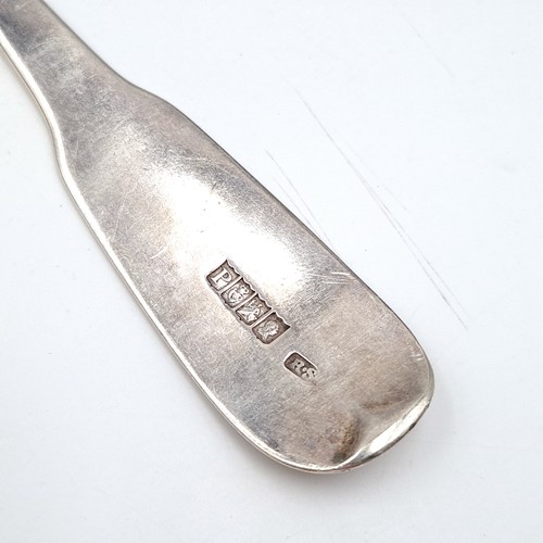 1085 - A very large Irish silver serving spoon. Hallmarked to Dublin and made by Reid & Son silversmiths. W... 