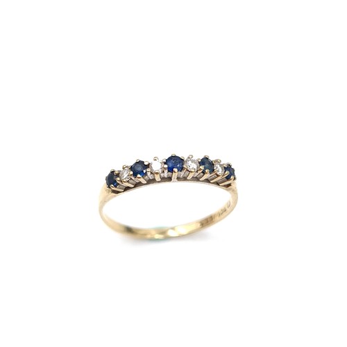 1117 - Star Lot : A pretty five stone sapphire ring with diamonds set in nine carat gold. Ring size: R. Wei... 