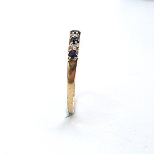 1117 - Star Lot : A pretty five stone sapphire ring with diamonds set in nine carat gold. Ring size: R. Wei... 