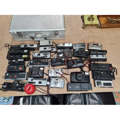 949 - A very large selection of vintage camera equipment held in a aluminium briefcase.  Some of these cam... 