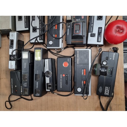 949 - A very large selection of vintage camera equipment held in a aluminium briefcase.  Some of these cam... 