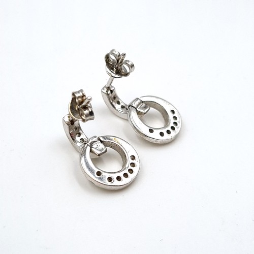 1136 - A pair of 9k White Gold earrings. Boxed. Total Weight: 1.1 g