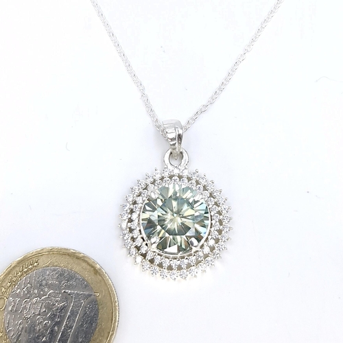 31 - A very good example of an oceanic aqua moissanite stone pendant necklace with gemstone surround. Len... 