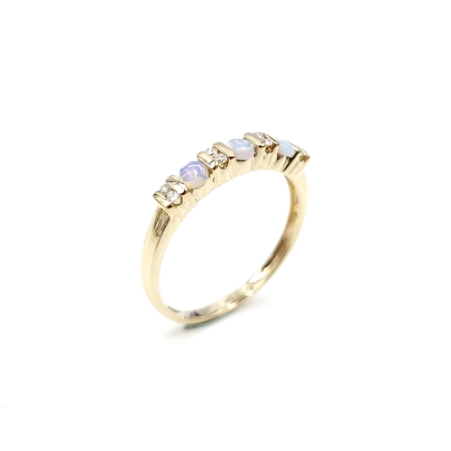 4 - Star Lot : A nine carat gold opal and diamond set ring. Size - S. Weight - 1.86 grams.