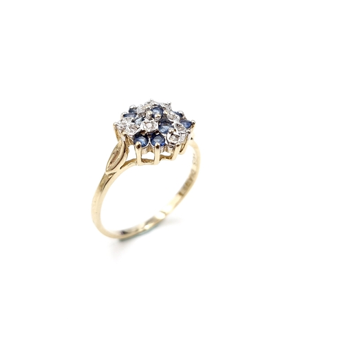 5 - A pretty nine carat gold sapphire and diamond cluster ring. Size - P. Weight - 2.12 grams.