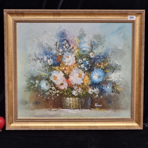 86 - An original oil on canvas painting of a still life of flowers potted in a wicker basket. Rendered in... 