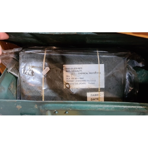 469 - Metal ammunition box, vintage military-style, contains a casualty chemical protective bag. Stamped i... 