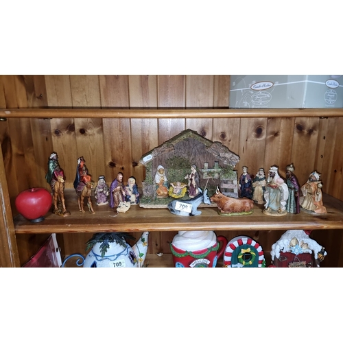 Italian Nativity set with 14 painted figurines, marked "Italy 2607." Includes figurines and animals.