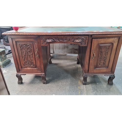 1004 - Star Lot : Antique carved oak desk, featuring intricate detailing, with a green tooled leather writi... 