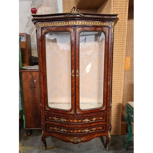 994 - Star Lot : A large beautiful Louis XV-style display cabinet, featuring intricate marquetry and bronz... 