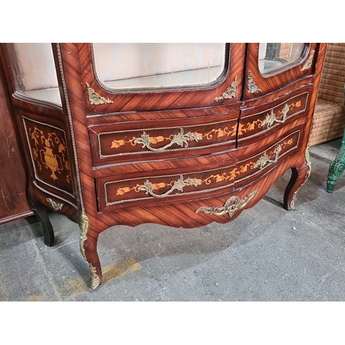 994 - Star Lot : A large beautiful Louis XV-style display cabinet, featuring intricate marquetry and bronz... 