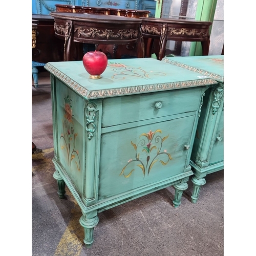 999 - Star Lot : A lovely Pair of hand-painted turquoise nightstands featuring floral motifs and carved de... 