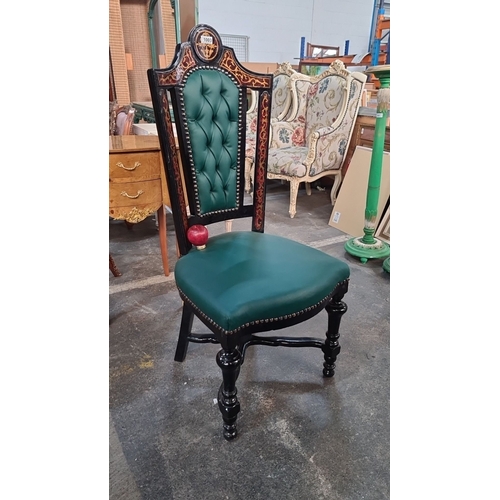 1003 - Star Lot : A handsome Victorian-style chair with green tufted upholstery, black lacquered wood, and ... 