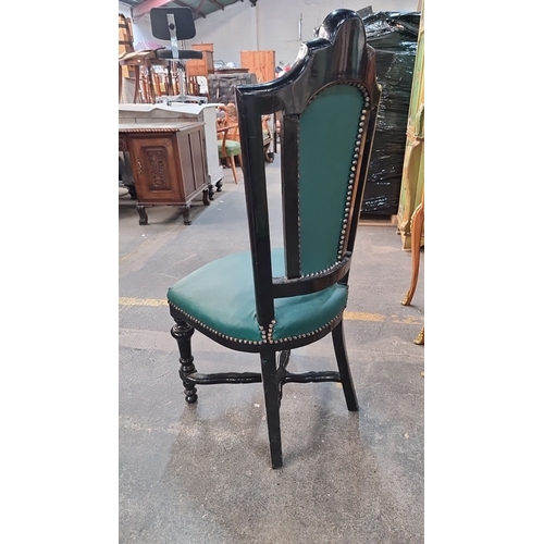 1003 - Star Lot : A handsome Victorian-style chair with green tufted upholstery, black lacquered wood, and ... 