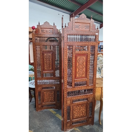 1005 - Super Star Lot : A very cool large Middle Eastern style Carved wooden room divider, featuring lattic... 