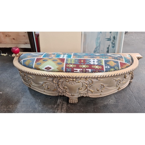 995 - Star Lot : A lovely Carved gilt wooden bench with ornate detailing and vibrant, patterned upholstery... 