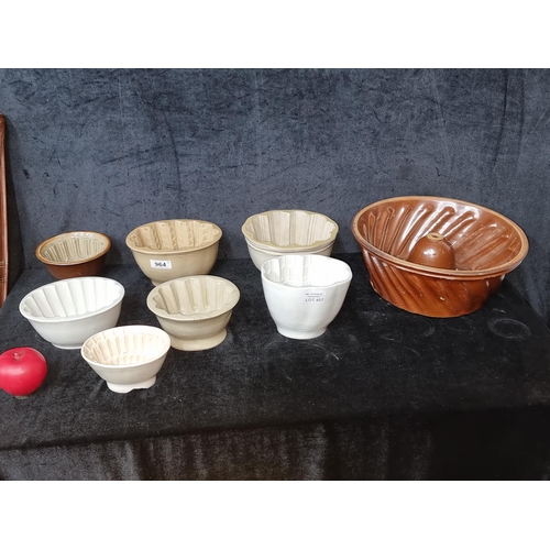 964 - A selection of eight antique Stateley home stoneware jelly molds including a large salt glazed examp... 