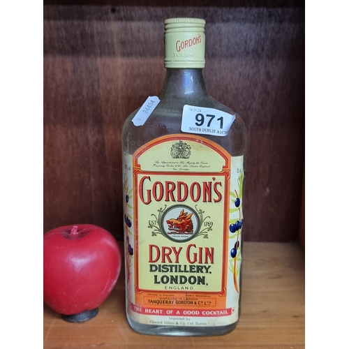 971 - A 750 ml bottle of Gordon's Dry Gin, Distillery London. Sealed, unopened.