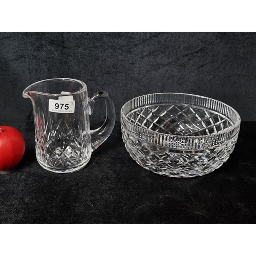 975 - Two Waterford Crystal pieces including a jug in the Lismore patten and in the Killeen pattern. Both ... 