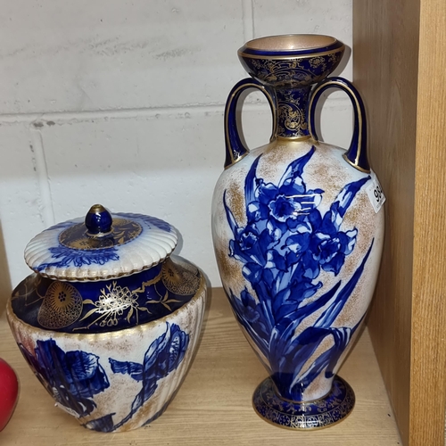 984 - An antique pair of Royal Doulton Burslem pieces featuring a vase and a lidded jar with floral motifs... 