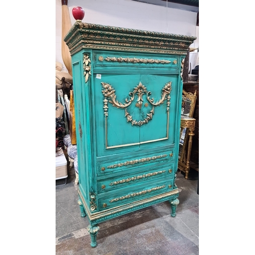 1198 - Star lot : A French Chateau Neoclassical-style turquoise armoire with gilded floral details, double ... 