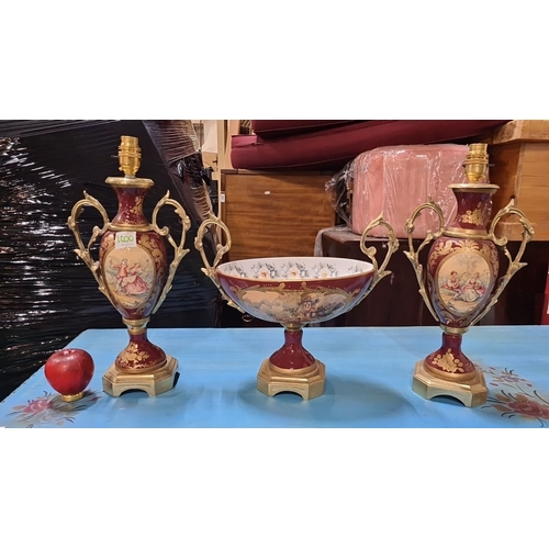 1200 - Star Lot : Porcelain garniture set with painted romantic scenes, gold-accented handles, and bases. I... 