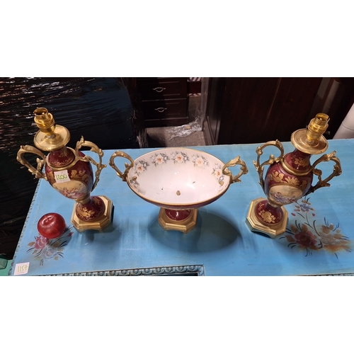 1200 - Star Lot : Porcelain garniture set with painted romantic scenes, gold-accented handles, and bases. I... 