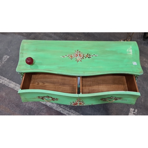 1202 - Star lot : A French chateau Green-painted wooden chest of drawers  with floral motif, featuring two ... 