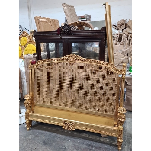 1204 - Star lot ; a Beautiful Gilded wood and wicker bed , intricately carved with floral motifs, reflectin... 