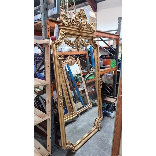 1206 - Super Star lot : A large Gilded Baroque-style mirror with intricate floral and cherub detailing. Fab... 