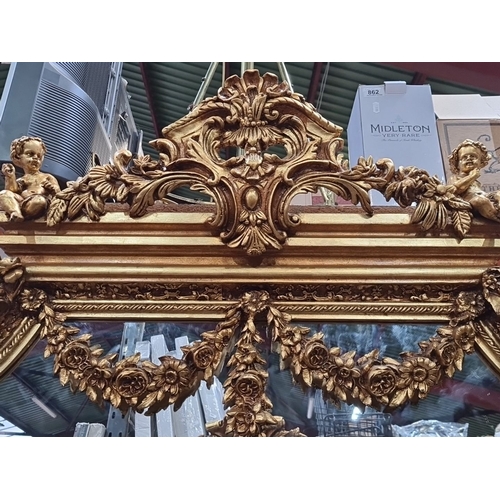 1206 - Super Star lot : A large Gilded Baroque-style mirror with intricate floral and cherub detailing. Fab... 