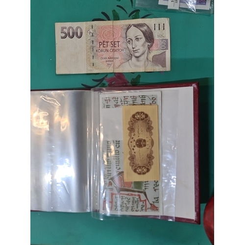 1207 - Collection of international banknotes housed in a red leather album with gilt border, from China, Si... 