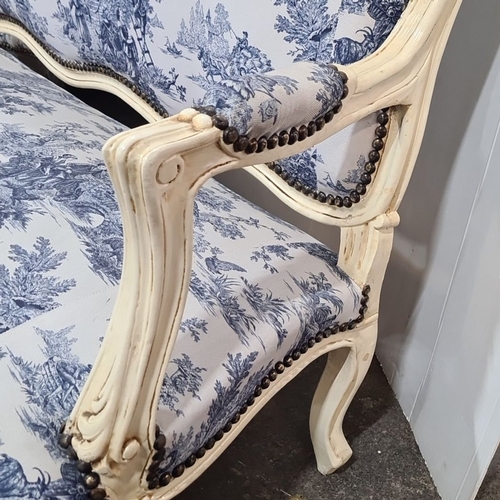 1217 - Star lot  : A French-style Louis XVI style settee, intricately carved wood frame with toile de Jouy ... 