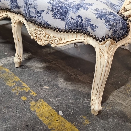 1217 - Star lot  : A French-style Louis XVI style settee, intricately carved wood frame with toile de Jouy ... 