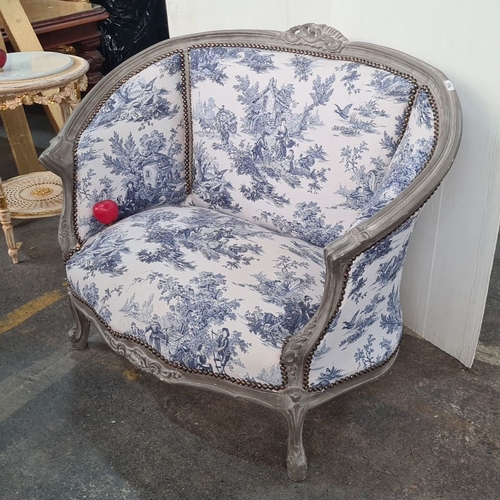 1228 - Star Lot : Louis XV style bergère with blue and white toile upholstery, featuring carved wood detail... 