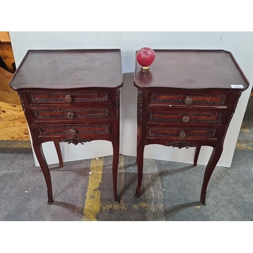 1230 - Star Lot : A Pair of Victorian style mahogany bedside tables with ornate carved detailing, three dra... 