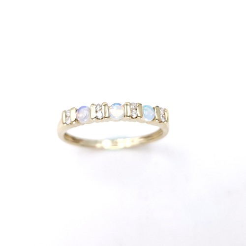 4 - Star Lot : A nine carat gold opal and diamond set ring. Size - S. Weight - 1.86 grams.