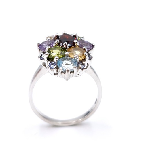 14 - A sterling silver multi stone ring set with garnet, peridot, citrine, amethyst & aquamarine stones. ... 