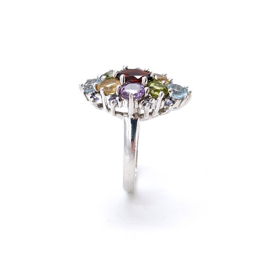 14 - A sterling silver multi stone ring set with garnet, peridot, citrine, amethyst & aquamarine stones. ... 