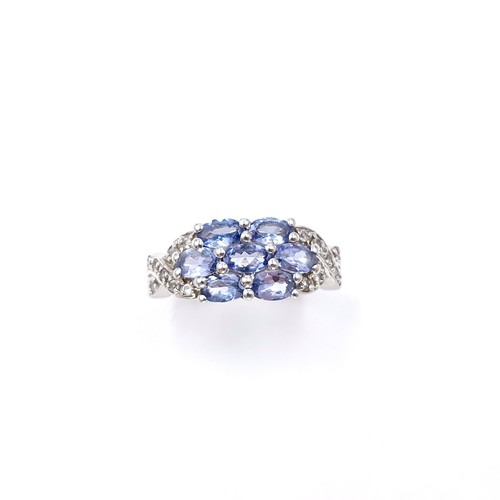 15 - A lovely multi stone tanzanite ring set in sterling silver. Size - Q. Weight - 4 grams.