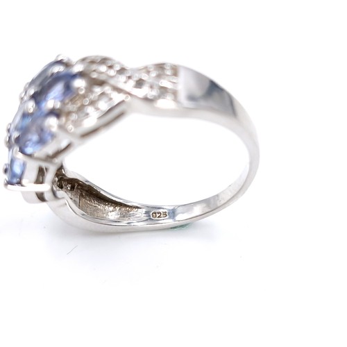 15 - A lovely multi stone tanzanite ring set in sterling silver. Size - Q. Weight - 4 grams.