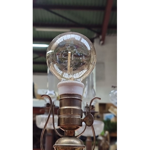 406 - An Antique ship or train lamp with a floating gimbal and large Edison Bulb.