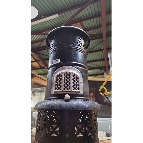 409 - Star Lot : A fabulous Vintage large black cast iron stove, model 525-R, with intricate floral cut-ou... 