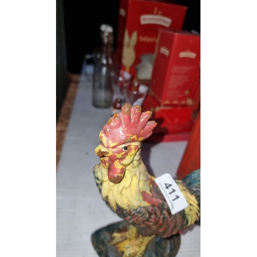 411 - Cast iron heavy rooster doorstop with vibrant hand-painted detailing.