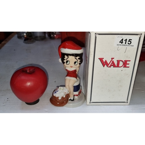 415 - A vintage Wade ceramic Betty Boop figurine in festive attire, includes original box.