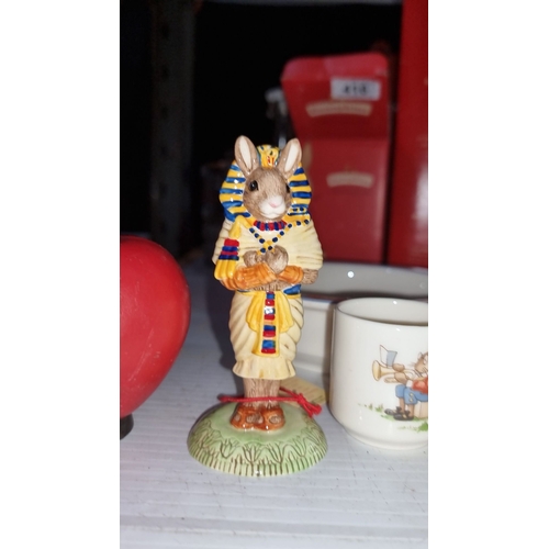 416 - Royal Doulton Bunnykins collection includes a bowl, mug, egg cup, and Pharaoh Mouse figurine with wh... 