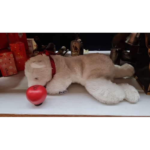 424 - A large Plush Christmas Coca Cola polar bear with a festive red ribbon, accompanied by a red apple a... 